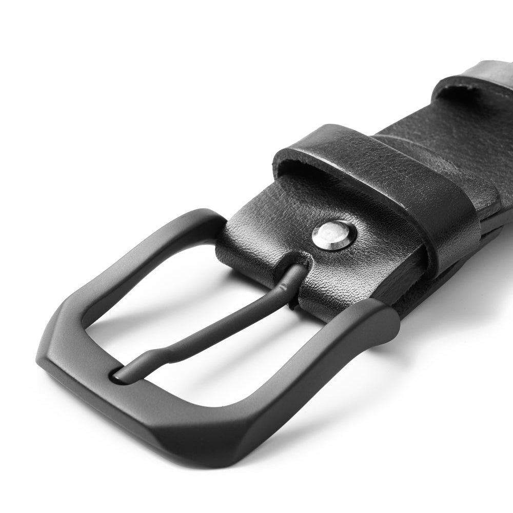 A side angle image of the Pando Belt focusing on the matte black anodized metal buckle and the nine-hole design, emphasizing the belt's modern, minimalist style.

